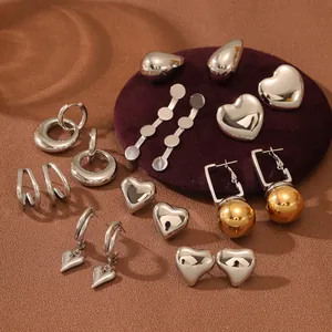 Polished silver stainless steel earrings set with heart, drop, and hoop designs