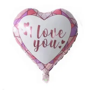 Detail of pink heart foil balloon with I Love You print for Valentine's Day decorations