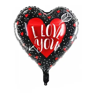 Detail of heart-shaped foil balloon with I Love You text and red heart pattern