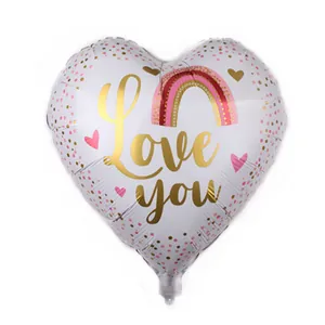 Heart-shaped foil balloon with Love You gold script and rainbow for wedding decor