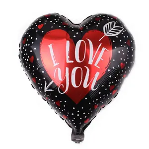 18 inch heart-shaped foil balloon with white dots and I Love You text for Valentines