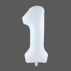 Close-up of matte white foil balloon shaped as number 1 for birthday party decor