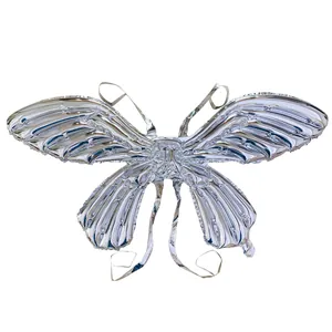 Close-up of metallic silver butterfly wing balloon showing texture and reflective foil material