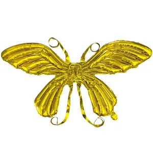 Detailed close-up of golden butterfly wing foil balloon with metallic texture and sheen