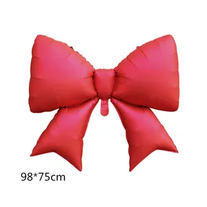 Detailed view of large red bow foil balloon measuring 98x75cm for party decoration