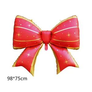 Macro detail of large red bow balloon with gold trim and 98x75cm size spec