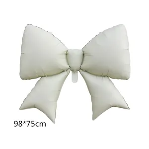 Large cream white bow-shaped foil balloon measuring 98x75cm for birthday party decoration