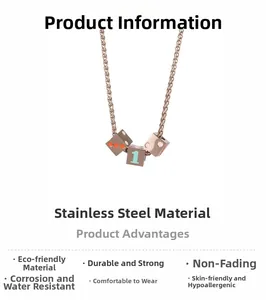 Detail of rose gold stainless steel dice cube pendants with number one engraving