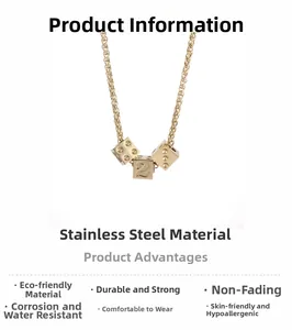 Close-up of golden stainless steel wheat chain necklace with lucky number 2 dice pendant