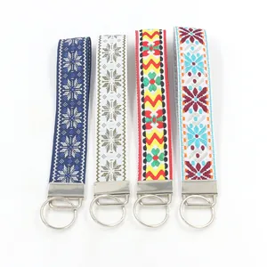 Detailed view of four ethnic jacquard woven wristlet keychains with metal clasps