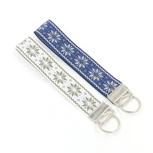 Nordic snowflake jacquard woven strap keychains with metallic silver rings and clips