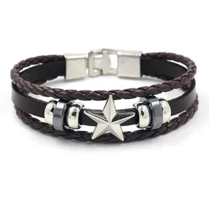 Detail of multi-layer leather bracelet with metal star ornament and toggle clasp