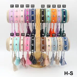 Bracelets tissés ethniques avec clous cœur argentés et glands en 20 couleurs