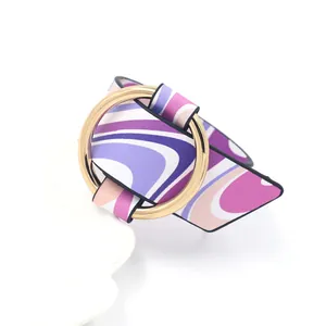 Detailed view of the wavy purple pattern PU leather strap and golden metal buckle