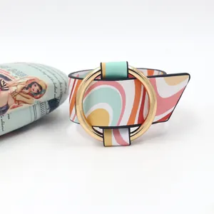 Detail of colorful wave pattern PU leather wide bracelet with large gold metal ring buckle