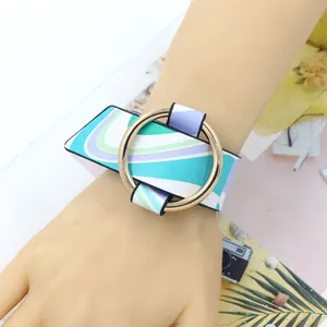 Wide colorful wave pattern PU leather cuff bracelet with a large gold metal ring