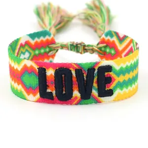 Handwoven friendship bracelet with 3D LOVE embroidery, colorful patterns and tassels