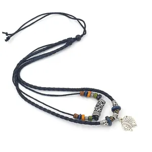Detail of beaded ethnic necklace featuring multi-colored wood beads and tribal pendant