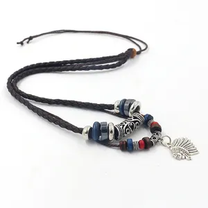 Detail of tribal necklace featuring multi-layer beads and Indian chief metal pendant