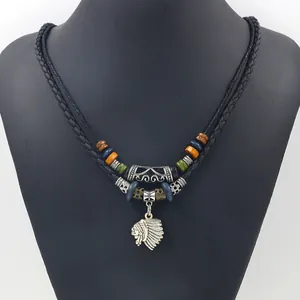 Detailed macro of tribal necklace with Indian chief pendant and colorful beaded layers