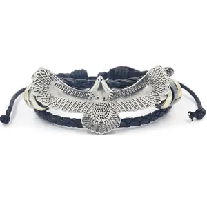 Pulsera multicapa de cuero trenzado para hombre con dije de águila en metal plateado