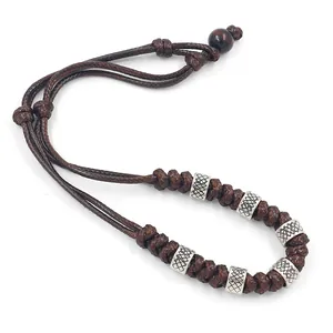 Handmade brown braided cord necklace for men with vintage silver engraved metal rings