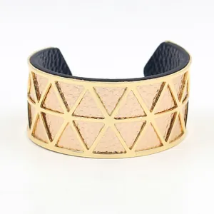 Gold hollow geometric cuff bracelet with double-sided pink and blue leather inserts