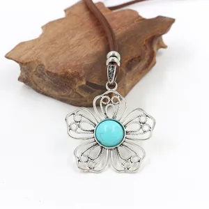 Vintage bohemian flower necklace with turquoise stone and antique silver filigree pendant