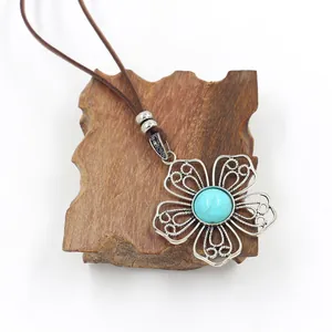Ethnic style flower pendant necklace with turquoise stone on brown leather cord