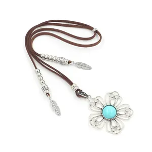 Bohemian turquoise flower pendant necklace with long brown cord and silver feather charms