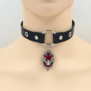 Gothic leather choker with silver grommets and red gemstone bat pendant necklace