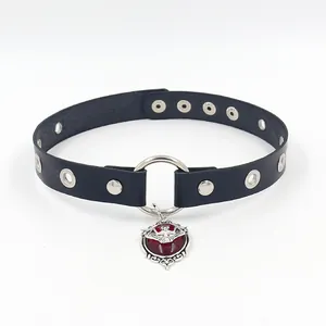 Detail of gothic leather choker with red gemstone bat pendant and silver metal ring