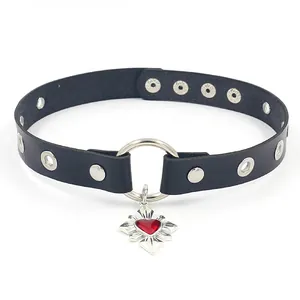 Detail view of black PU leather choker with silver ring and red heart cross pendant