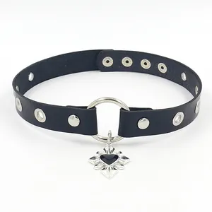 Detail of punk leather choker with silver O-ring and heart cross pendant detail