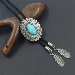 Vintage Bolo Tie with turquoise stone and silver feather pendants on a braided cord