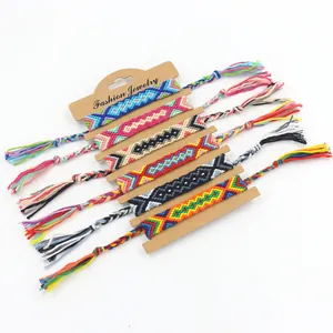 Close-up of handmade bohemian woven friendship bracelets with colorful geometric patterns