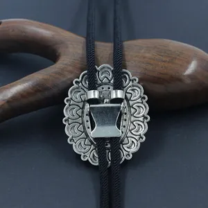Retro silver Bolo Tie with engraved crescent patterns and black braided leather cord