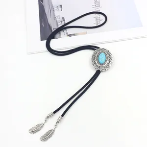Western Bolo Tie with turquoise stone and feather pendants on black braided cord