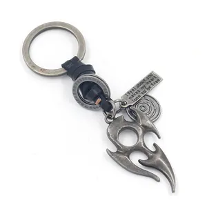 Vintage silver flame totem pendant keychain with braided leather strap and engraved metal tag
