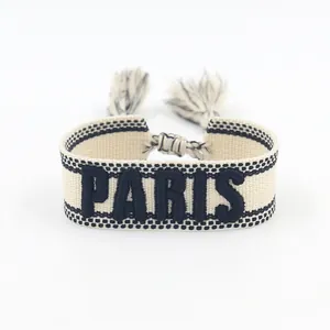 Bohemian embroidered PARIS friendship bracelet with tassel accents and woven texture