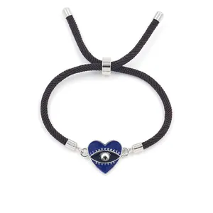 Pulsera de cordón trenzado marrón ajustable con dije de corazón azul de ojo turco