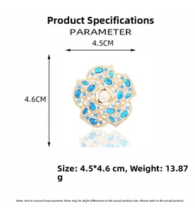 Detailed view of camellia brooch with blue zircons and pearl, size 4.5*4.6cm