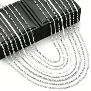 Men's stainless steel necklace set with various silver chain styles on black gift boxes