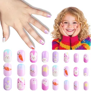 Detail of pink and purple cartoon press-on nails with cute rabbit and star prints