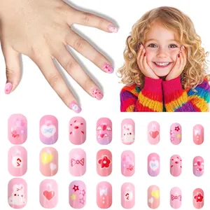 Detailed view of 24pcs pink cartoon press-on nails for kids with cute heart and bunny patterns