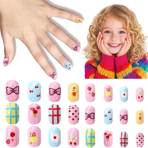 Detailed view of colorful cartoon press-on nails for kids featuring cute macaron patterns