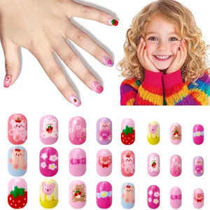 Detailed view of 24pcs pink and blue press-on nails with cute cartoon bears and strawberries