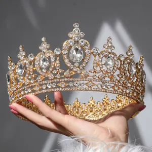 Luxurious gold bridal crown with brilliant white pear-shaped rhinestones for weddings