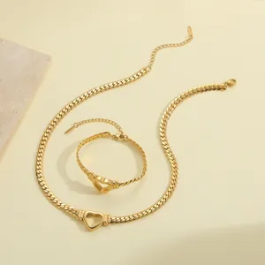 Gold stainless steel curb chain jewelry set with hollow heart pendants for women