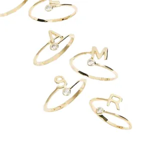 Elegant gold initial rings with round diamonds and adjustable open band design
